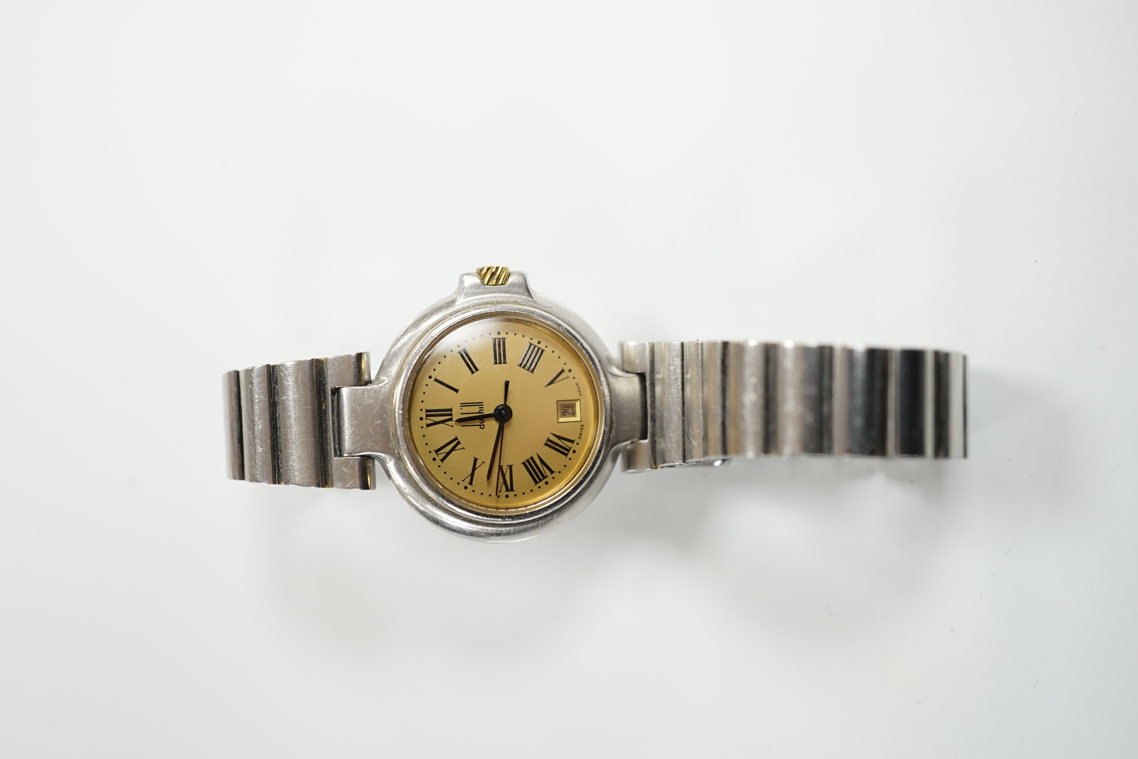 A lady's 1970's stainless steel Dunhill quartz wrist watch, with centre seconds and date aperture with box and papers.